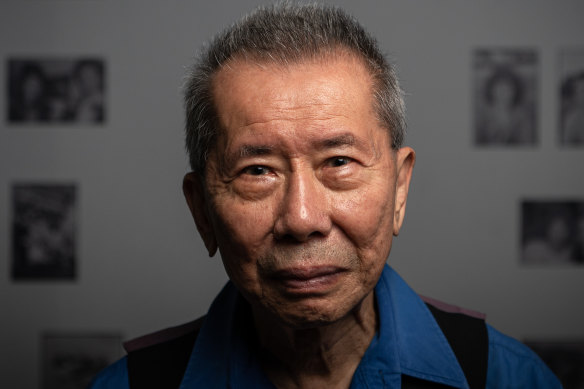 William Yang with his exhibition.