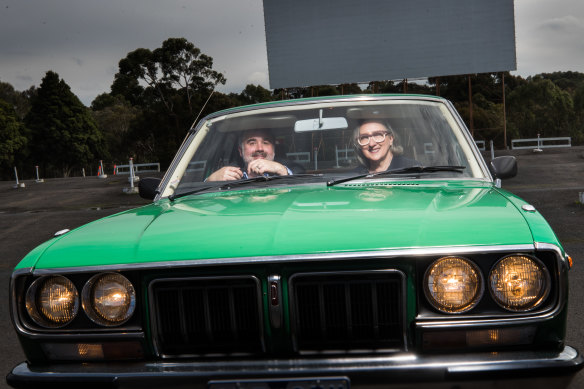 MIFF’s artistic director Al Cossar and chair Teresa Zolnierkiewicz test drive the Coburg Drive-in, one of the locations for this year’s “hybrid” event. 