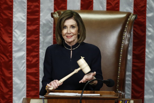 US House Speaker Nancy Pelosi holds the gavel during a vote on the two articles of impeachment.