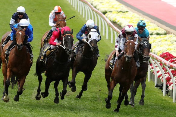 John Allen rides Cliff's Edge to victory in the Crystal Mile.