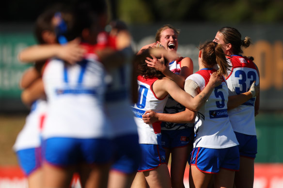 Special feeling: Western Bulldogs players mark the moment.