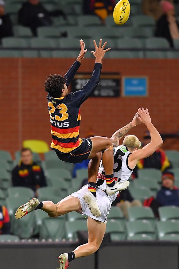 Shane McAdam takes a screamer over Jack Crisp.