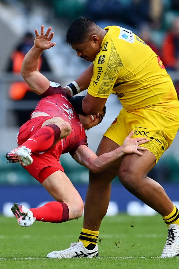 Antoine Dupont of Toulouse is tackled by La Rochelle’s Will Skelton.
