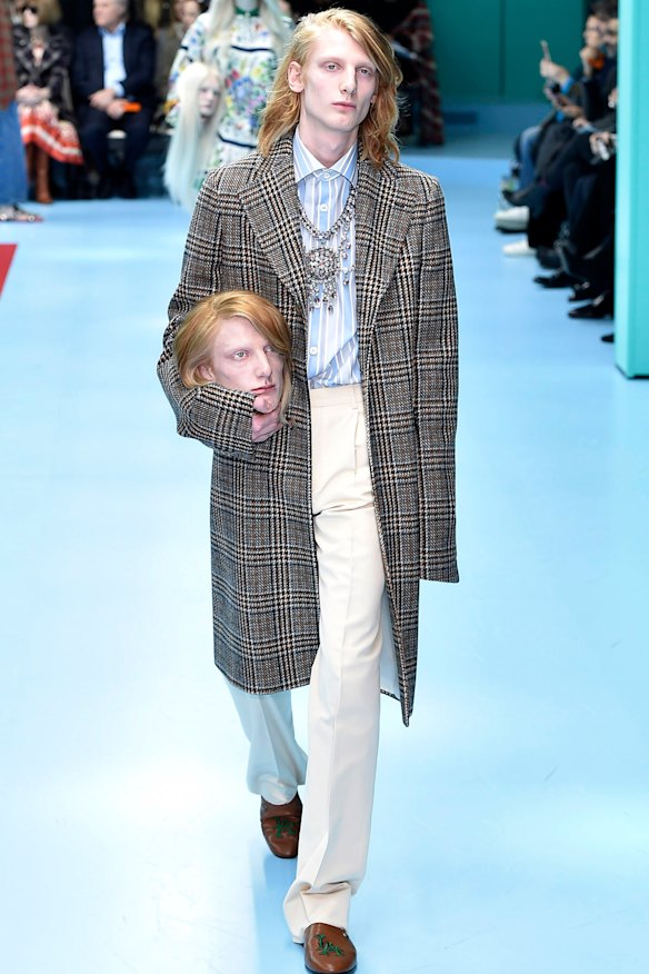 Models carried replicas of their heads at Gucci’s autumn 2018 fashion show in Milan.