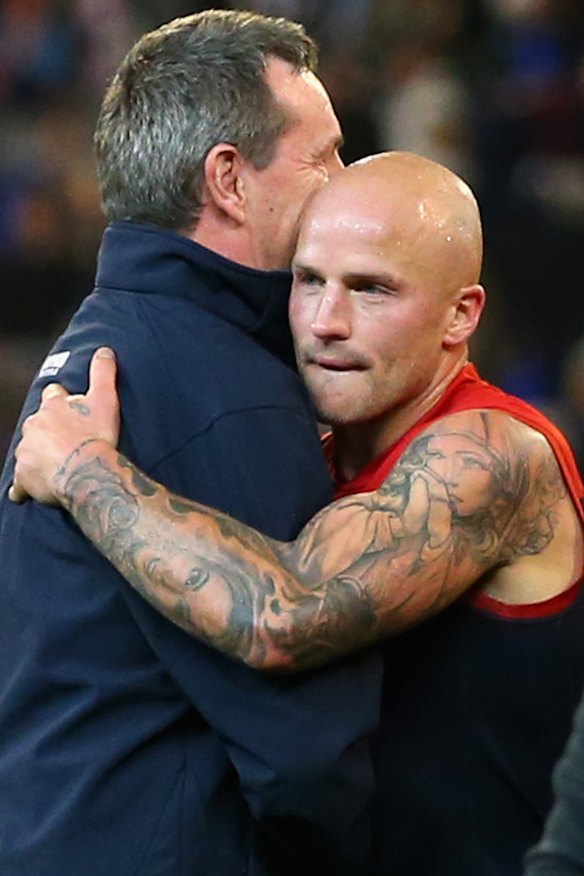 Daniher and Jones embrace in 2015.