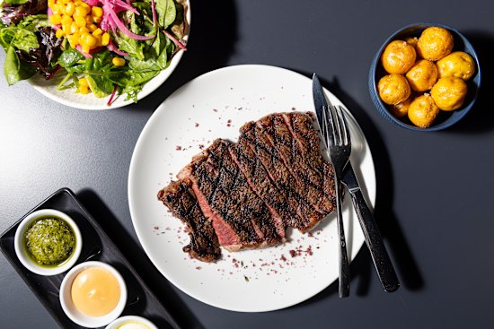 Mains, such as inside skirt steak, come with a salad, Colombian-style sauces – one a lemony sour cream, the other a zesty tomato – and a choice of fries, rice, plantain fritters, cassava chips or golden potatoes (pictured).