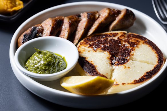 House-made chorizo with cheese arepa (corn flatbread).