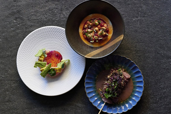 Noi dishes clockwise from left: bonito with finger lime and kale, beetroot, hazelnut and taleggio, and beef tongue with black mole and raisins.