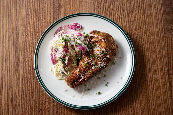 Crumbed pork chop, served bone-in after being brined for 24 hours.