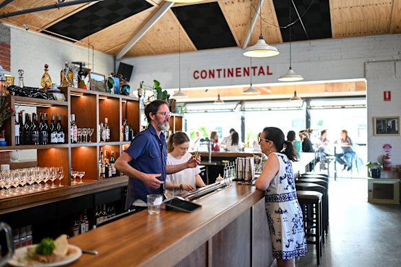 The bar, in the centre of the room, helps break up the huge space.