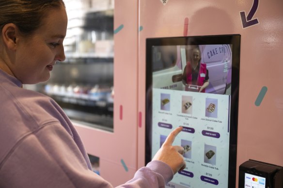 Matheson browses the menu of her vending machine.