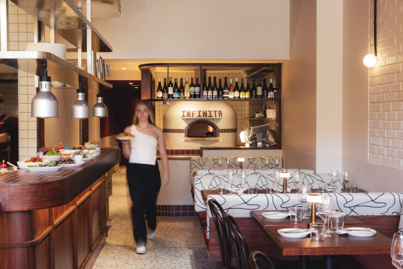 Bar Infinita inserts retro Italian touches into a modern setting, with a wood oven at its heart.
