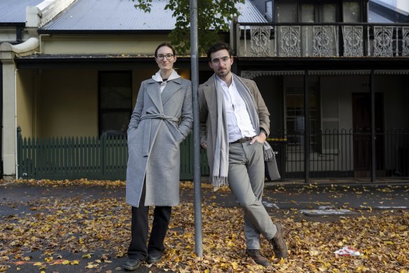 Katie Roberts-Hull and Jonathan O’Brien from the YIMBY group ( Yes In My Back Yard)  in fromt of some single fronted terrace homes in Grattan Street Carlton. Under the YIMBY’s ‘Missing Middle’ proposal, streets like this would be rezoned to accomodate six-storey buidings.

