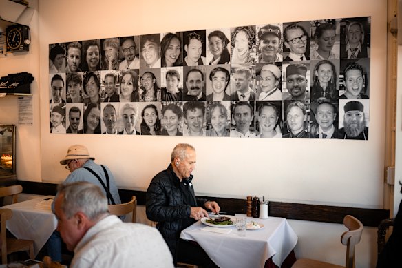 For the cafe's 40th anniversary, photos of current and former staff are displayed throughout the venue.