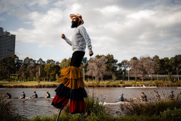 Colombian Santiago Vergara, who ran the Melbourne marathon on stilts, pictured here training by the Yarra River.