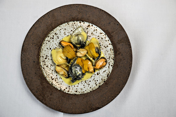 Cheese ravioli draped with sea urchin and served with mussels and yuzu butter.