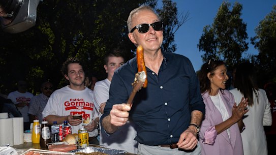 Opposition Leader Anthony Albanese cooks sausages during a bbq with Labor supporters at Altone Park in the seat of Cowan, in Perth, WA, on Saturday 30 April 2022. fedpol ausvotes22 Photo: Alex Ellinghausen