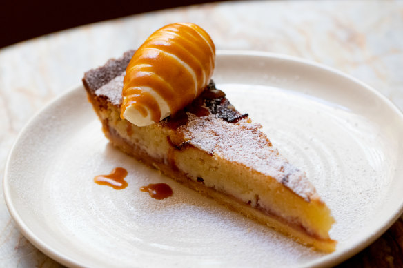 Almond and plum frangipane tart is gussied up with a dollop of mascarpone.