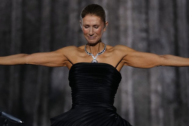 Singer Celine Dion performs during the opening concert of her ‘Celine Dion Paris 2026’ residency at the Plenitude Arena in Nanterre, outside Paris, Saturday, Sept. 12, 2026. (AP Photo/Aurelien Morissard)