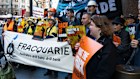 Macquarie Bank customers and shareholders, together with a coalition of environment and civil society organisations, protest outside 1 Elizabeth Street, Sydney, before Macquarie’s AGM.