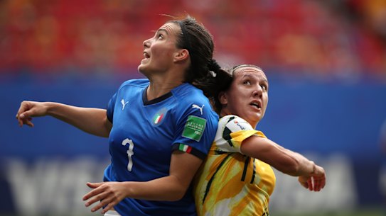 Australia's Lisa De Vanna, right, challenges Italy's Alia Guagni, left.