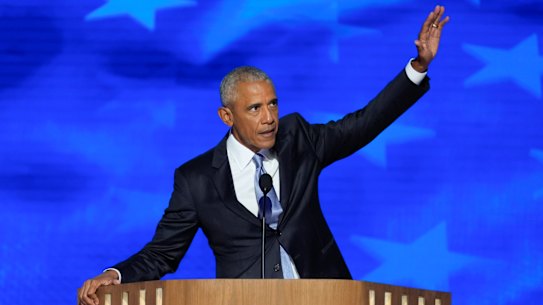 Former President Barack Obama gestures to the crowd at the Democratic National Convention.