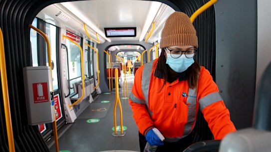 SYDNEY, AUSTRALIA - AUGUST 06: A member of the Sydney light rail cleaning team is seen wearing a face mask at Randwick Station on August 06, 2020 in Sydney, Australia. While face masks have not been made mandatory in New South Wales, state Premier Gladys Berejiklian has urged residents across the NSW to wear face masks when on public transport, in the supermarket, or in enclosed spaces where social distancing is difficult. (Photo by Lisa Maree Williams/Getty Images)