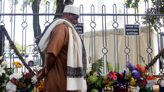A year on from the terrorist attacks, a member of the Muslim community arrives at Masjid An-Nur mosque in Christchurch, New Zealand.