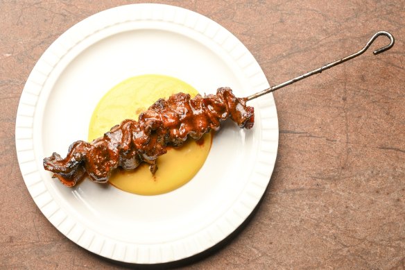 Ribbons of ox tongue are threaded onto skewers and served with a vibrant Peruvian carretillera sauce.