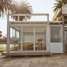 The glass-wrapped kiosk can be found on the Albert Park foreshore.