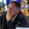 ASX finishes lower but miners shine; QBE slumps