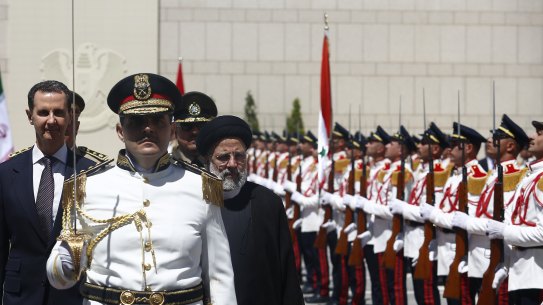 Syrian President Bashar al-Assad welcomes Iranian President Ebrahim Raisi at the Presidential Palace in Damascus last week.