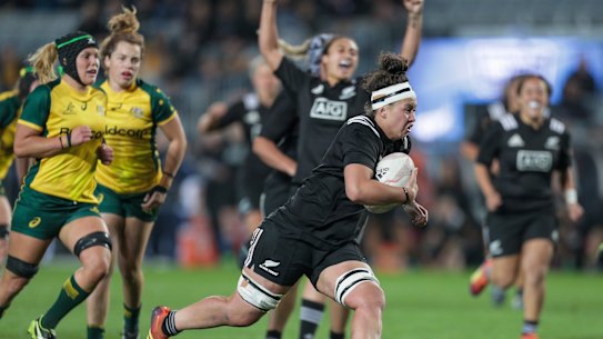 Charmaine McMenamin of New Zealand on her way to scoring a try against the Wallaroos.