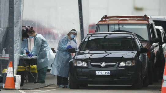 People queue up for COVID testing at a pop-up site at Dandenong, in Melbourne's south-east, on Thursday