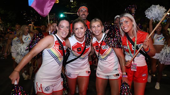 (L-R) Sydney Swans AFLW players Brooke Lochland, Alana Woodward and Maddy Collier walk in the Sydney Gay & Lesbian Mardi Gras Parade as part of Sydney WorldPride on February 25, 2023 in Sydney, Australia. The Sydney Gay and Lesbian Mardi Gras parade returns to Oxford Street in celebration of the event’s 45th anniversary.