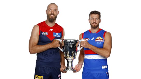 Melbourne skipper Max Gawn and Dogs captain Marcus Bontempelli with the premiership cup.