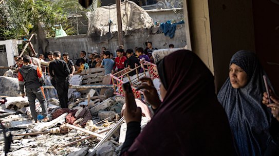 Members of the Abu Draz family inspect their house after it was hit by an Israeli airstrike in Rafah, southern Gaza Strip, on Thursday.