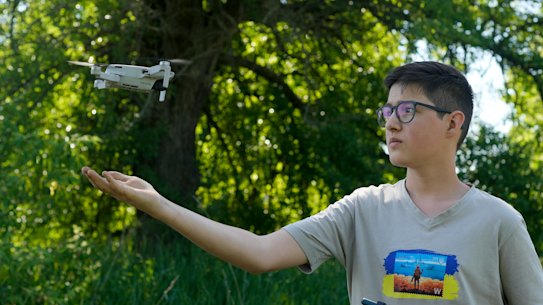 Andriy Pokrasa, 15, lands his drone on his hand. Andriy is being hailed in Ukraine for stealthy aerial reconnaissance work he has done with his dad in the ongoing war with Russia.