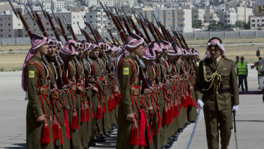 A Jordanian army officer inspects the honour guard in preparation for the arrival of Prince William.