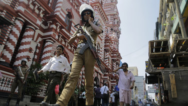 A Sri Lankan police officer patrols outside a mosque in Colombo on Wednesday.