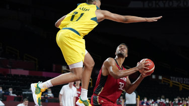 Australiaâs Dante Exum (11) tries to block a shot by Germanyâs Johannes Thiemann (32).