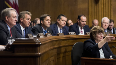Republican senators watch on as veteran sex crimes prosecutor Rachel Mitchell questions Dr Ford.