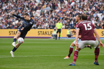 Jack Grealish scores for Manchester City against West Ham at London Stadium on Sunday.