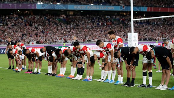 Japan players salute their fans after defeating Scotland at the 2019 World Cup.