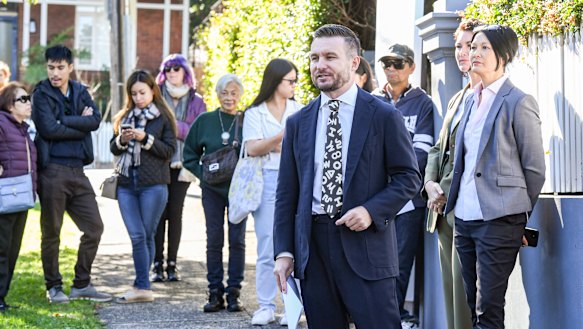 Auctioneer Thomas McGlynn took offers from three bidders.