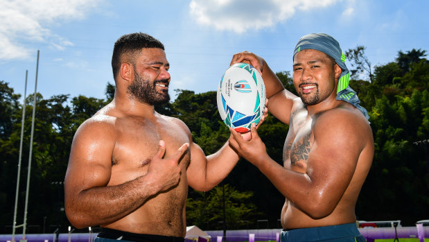 Cousins: Tolu Latu and Folau Faingaa are battling out to start for the Wallabies against Fiji on Saturday. 