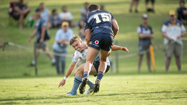 Where there's a Will: Will Harrison tackles Tom Banks in the Waratahs' pre-season trial against the Brumbies in Goulburn this year. 