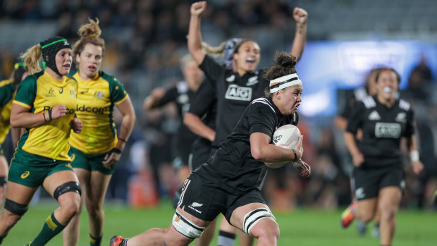 Charmaine McMenamin of New Zealand on her way to scoring a try against the Wallaroos.