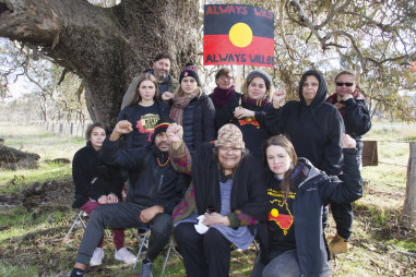 Elder Sandra Onus (front, second from right) with protesters at the site.