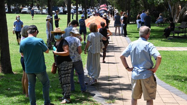 People line up to get a COVID-19 test at a pop-up testing site in Avalon on Thursday.